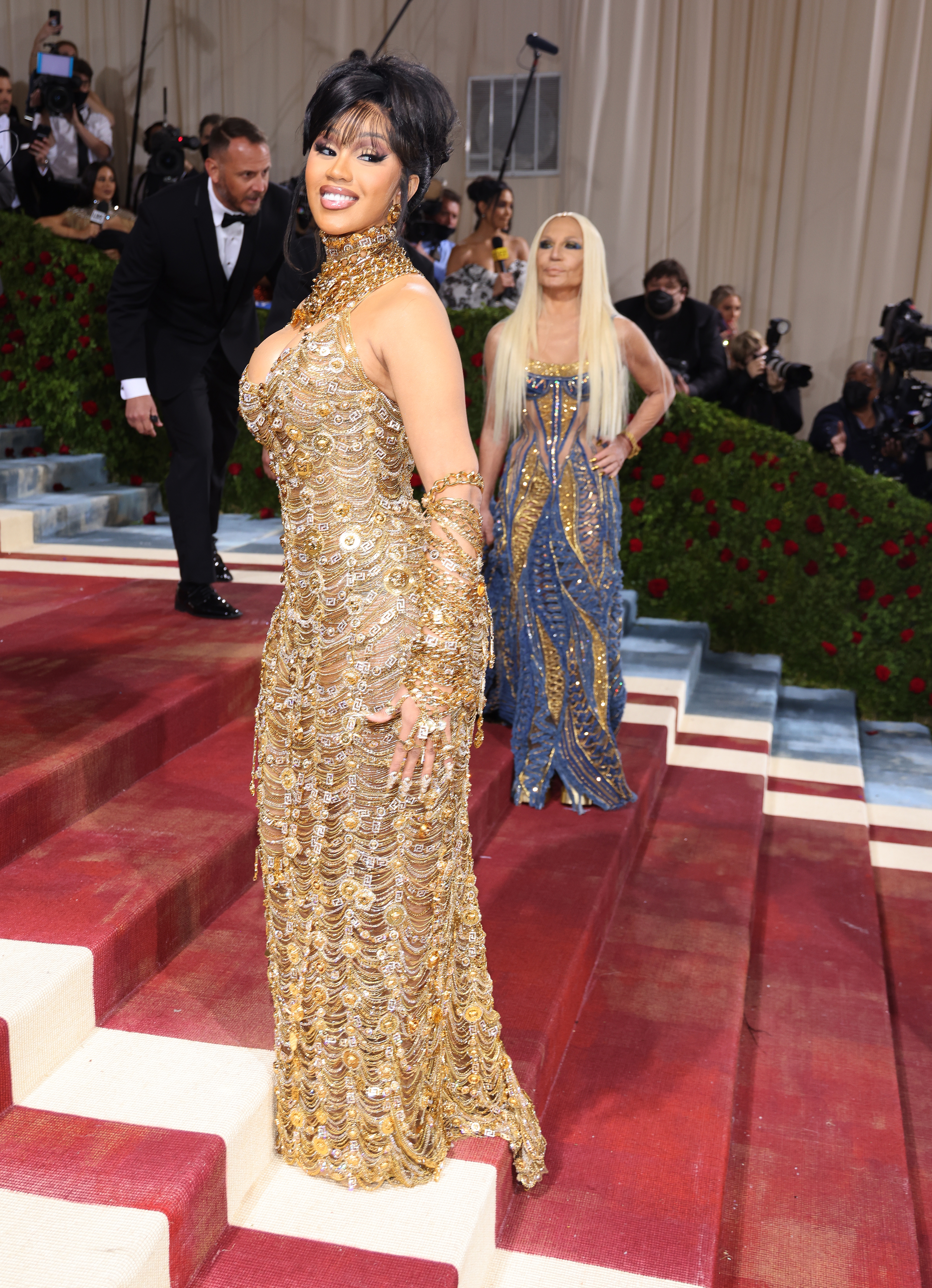 PHOTO Cardi B and Donatella Versace shine in matching gold gowns