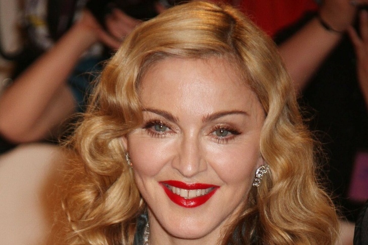 VIDEO: Madonna moves her hips in race bodysuit and fishnet stockings