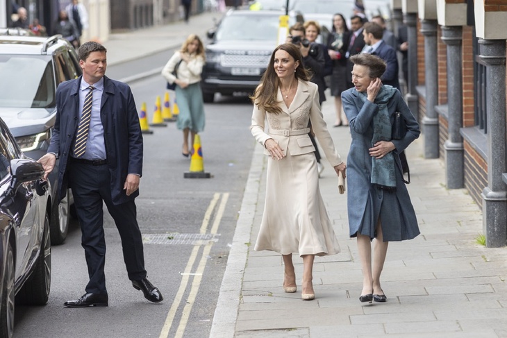 Happy Kate Middleton is seen walking with Princess Anna