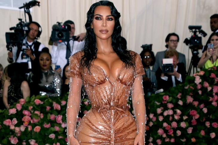 VIDEO: Kim Kardashian rocks a bejewel corset at Kourtney’s wedding
