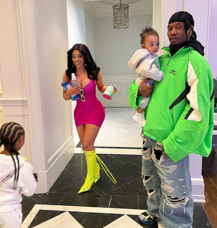 PHOTO: Cardi B flashes her ample cleavage in a neon dress while posing with  Offset