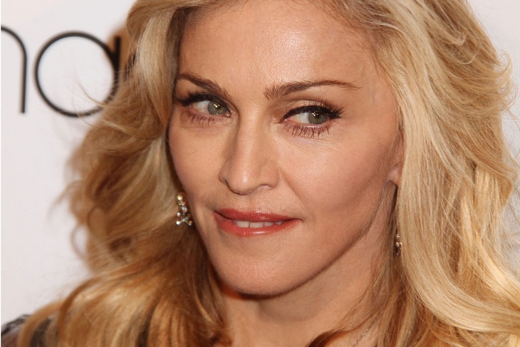PHOTO: Madonna poses in revealing shorts and a corset with her son David Banda